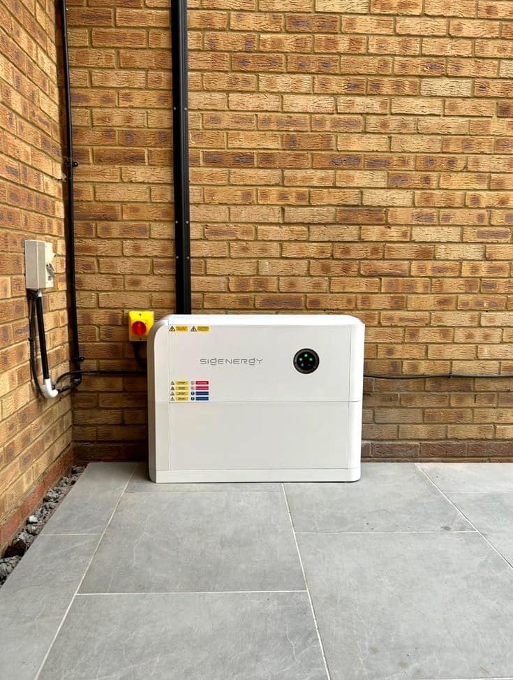 Sigenergy battery installed outside against a brick wall by Skylar Solar